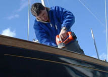 Jon hard at work preparing the wood prior to varnishing